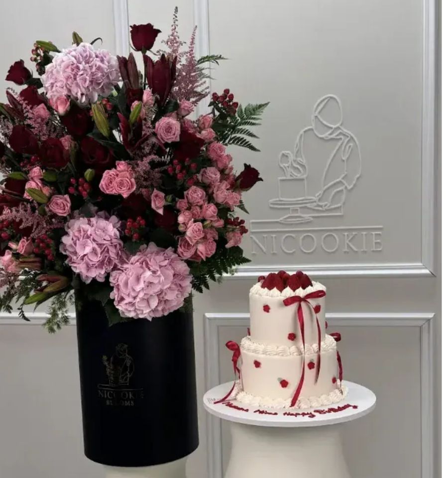 Burgundy Blush Garden Set with pink hydrangeas, roses, and a white cake.