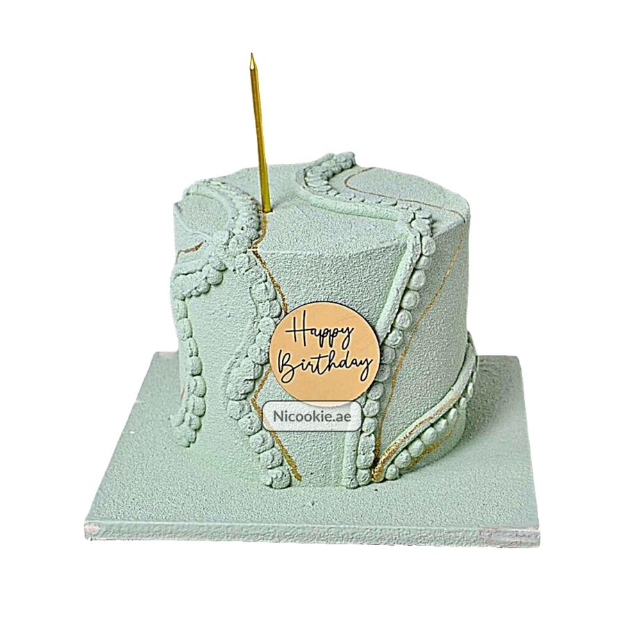 Mint green velvet cake with gold kintsugi design and "Happy Birthday" topper.