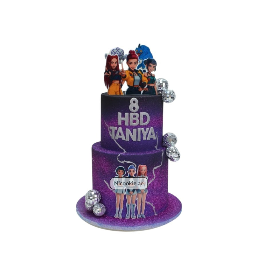 Purple two-tier cake with K-Pop figures and disco balls.