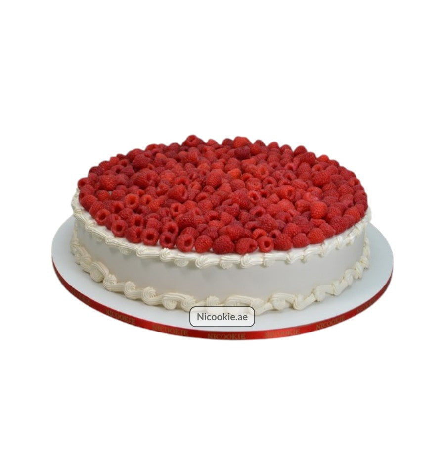 Raspberry Dream Cake with white frosting and a red ribbon.