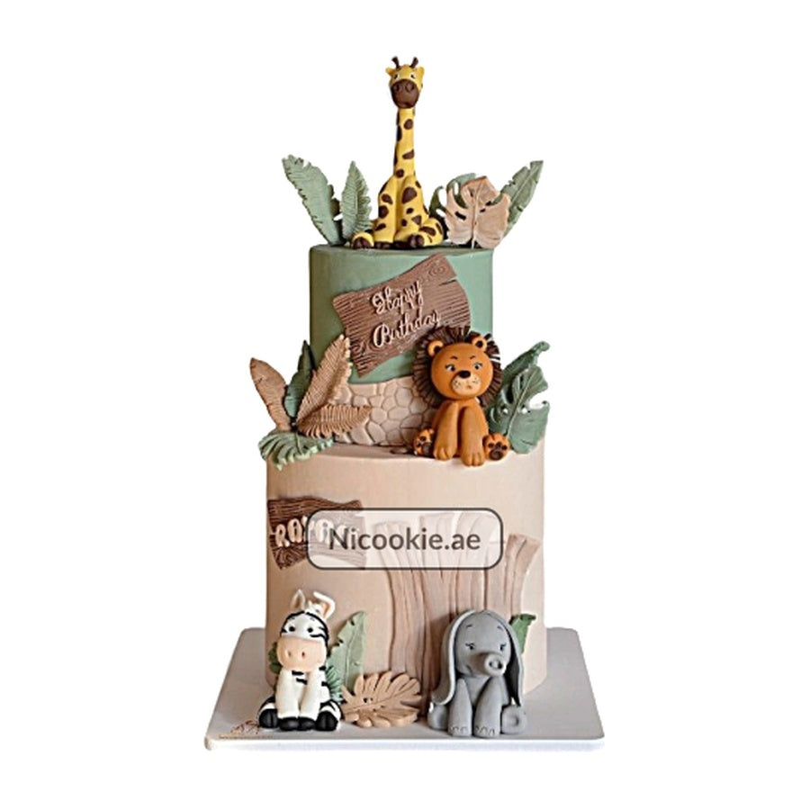 Safari jungle animal cake with giraffe, lion, zebra, and elephant decorations.
