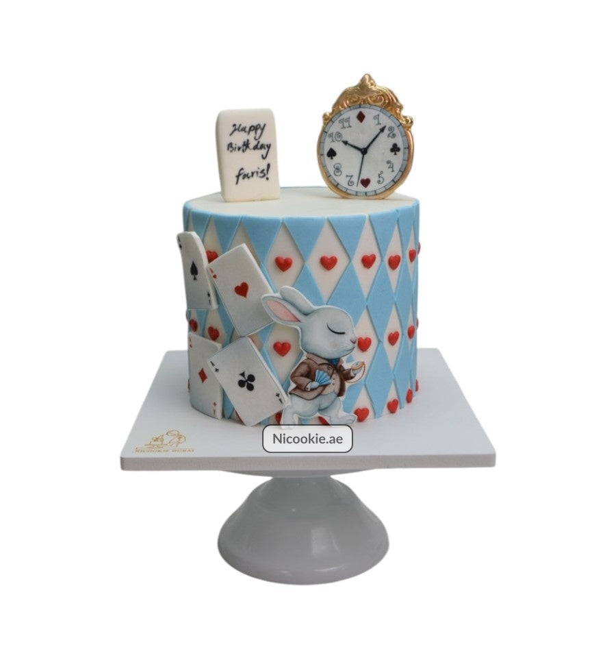 Wonderland White Rabbit cake with playing cards and a golden clock.