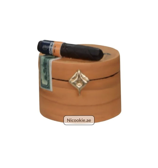 Cigar box cake with a cigar and dollar bill decoration.