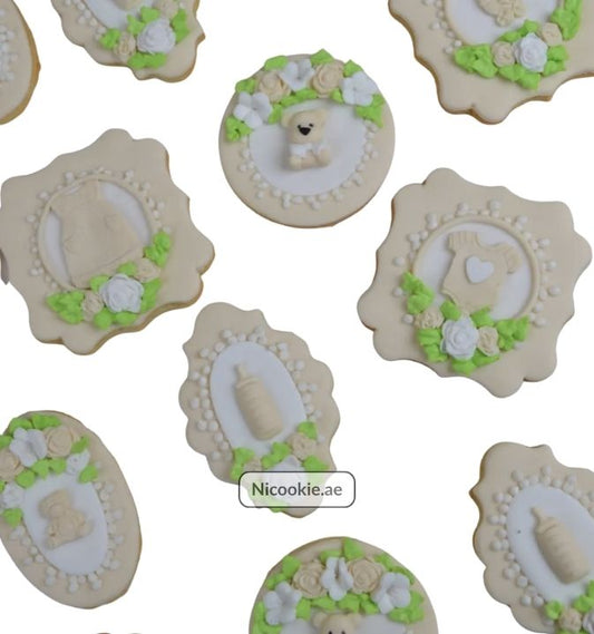 Baby Blossom cookies decorated with roses and baby motifs.