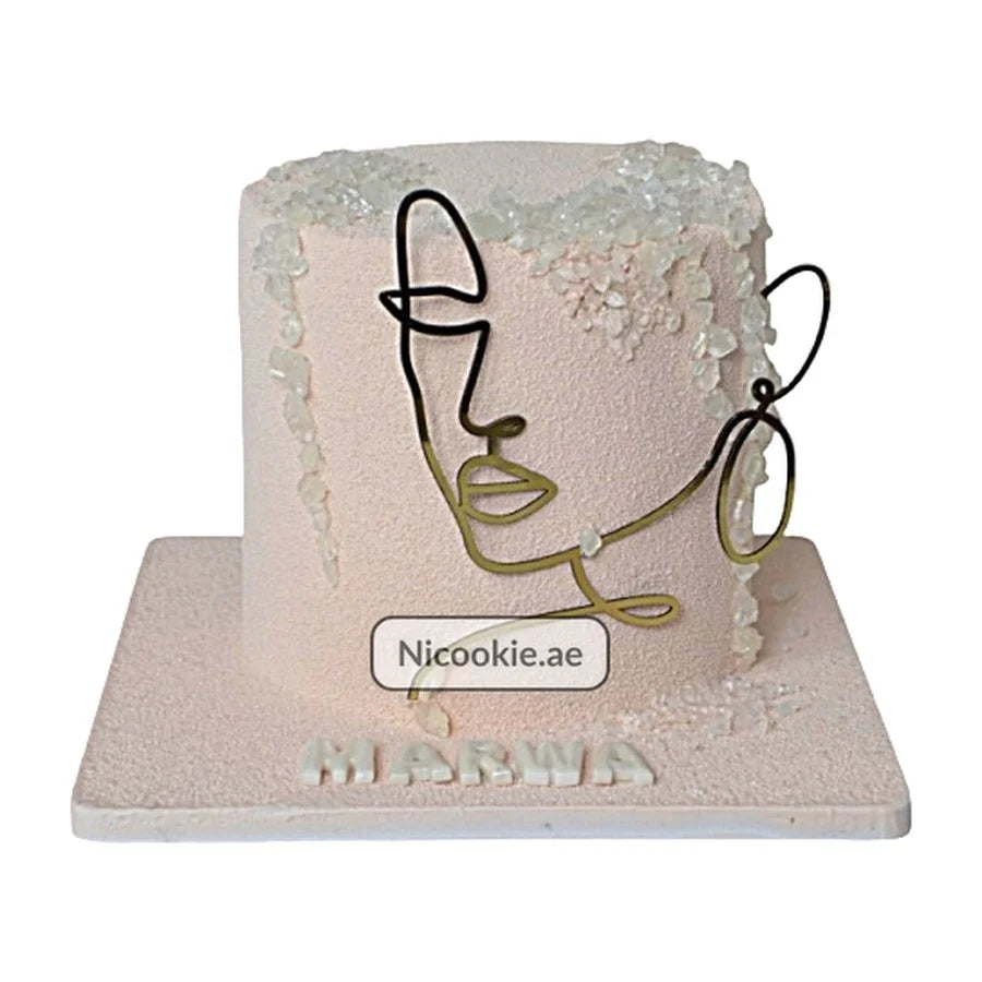 Abstract face art birthday cake with velvet finish and crystal decorations.