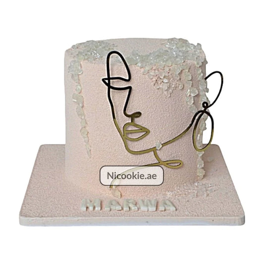 Abstract face art birthday cake with velvet finish and crystal decorations.