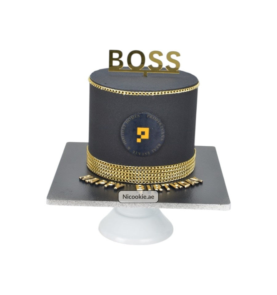 Black and gold boss cake with "BOSS" topper and "Happy Birthday" text.