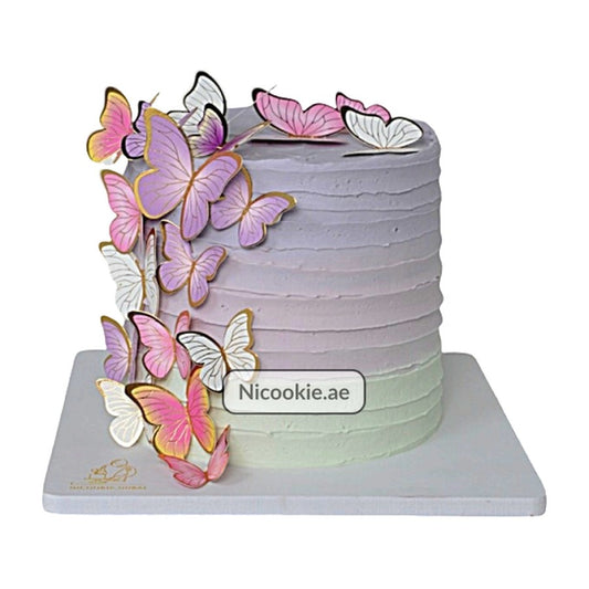Butterfly Ombre Cake with lilac to mint ombre and golden-edged butterflies.