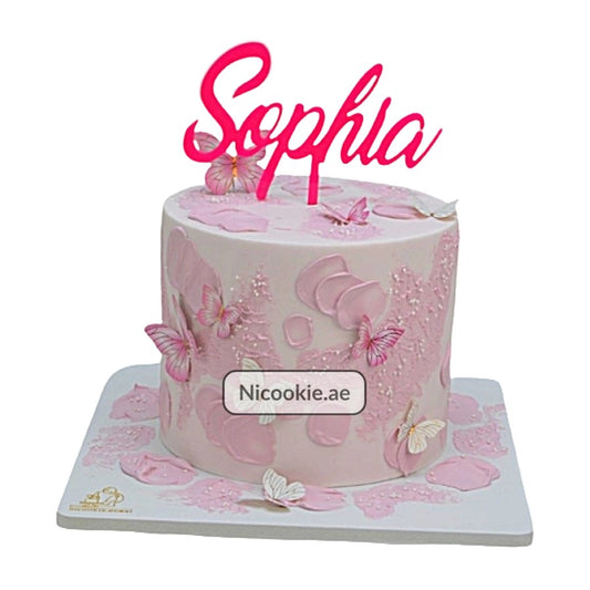 Pink butterfly birthday cake with a "Sophia" topper.