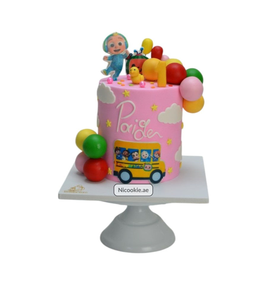 Cocomelon birthday cake with characters, balloons, and a school bus.