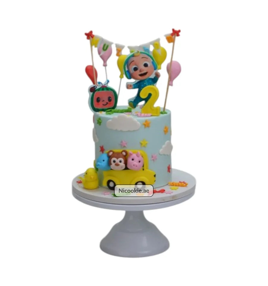 Cocomelon birthday cake with characters and a yellow car.