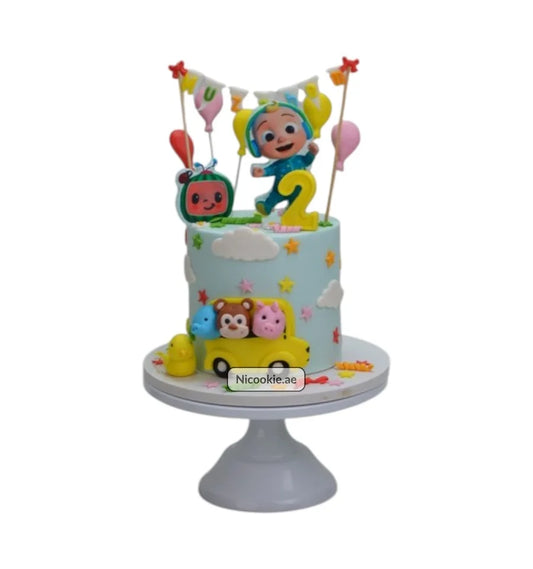 Cocomelon birthday cake with characters and a yellow car.