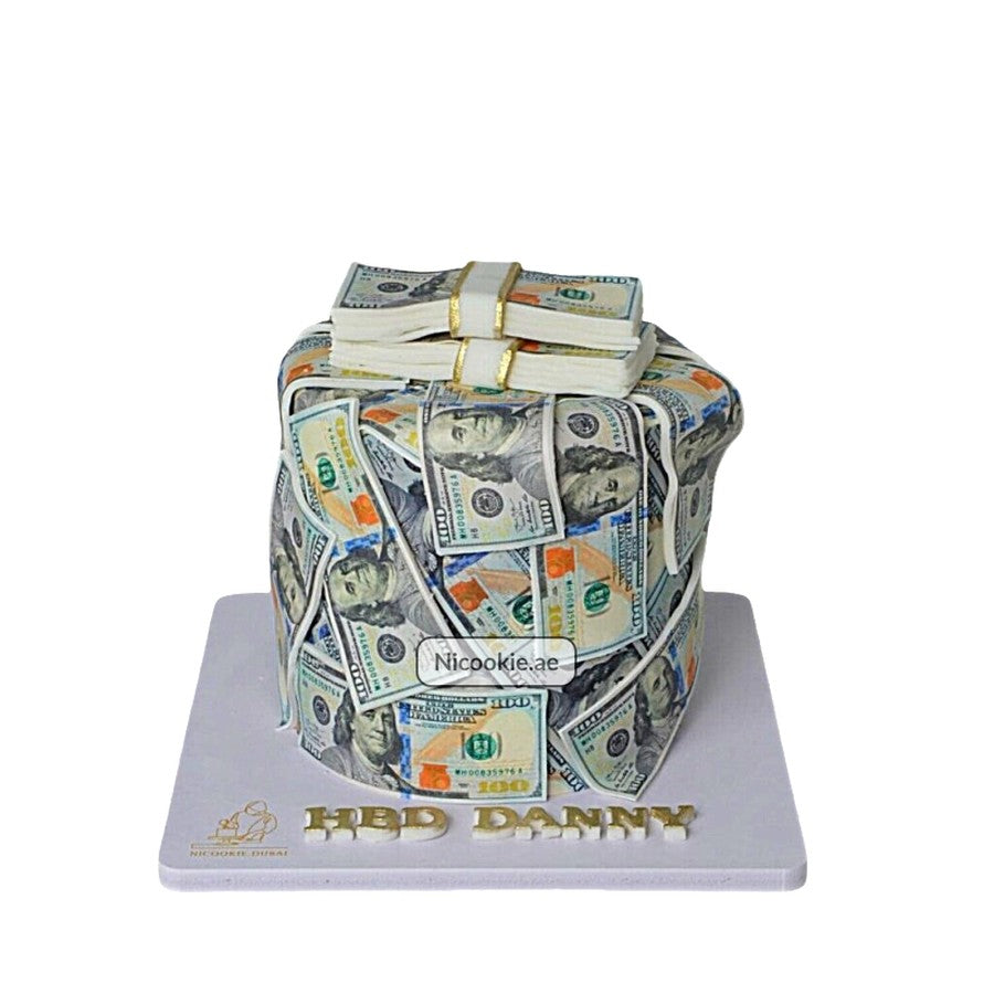 A cake decorated to look like a stack of $100 bills.