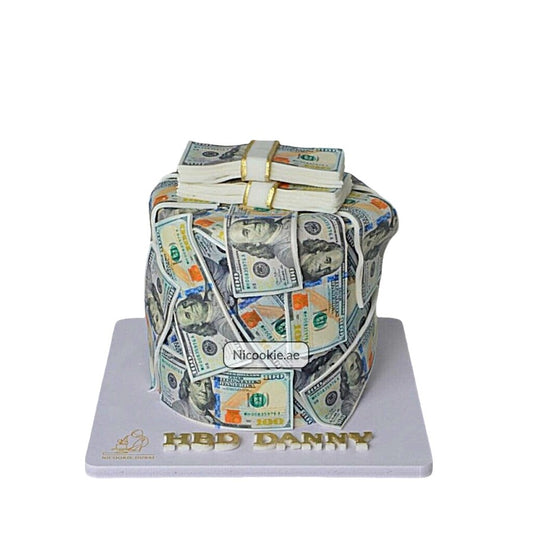 A cake decorated to look like a stack of $100 bills.
