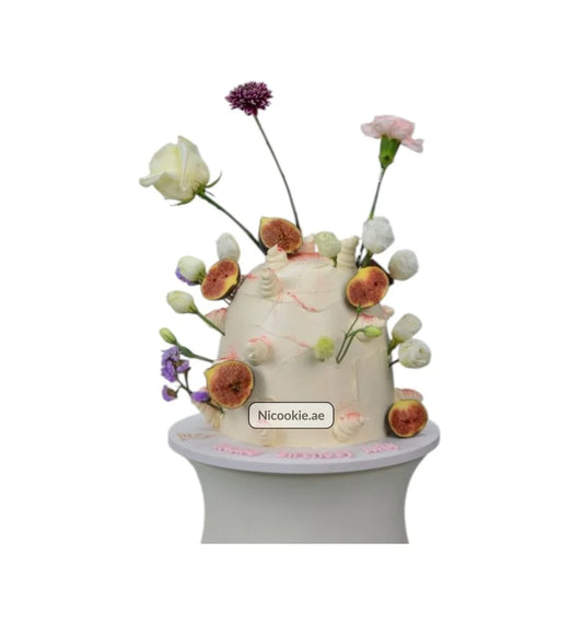 Fig Blossom Tower cake decorated with figs and fresh flowers.