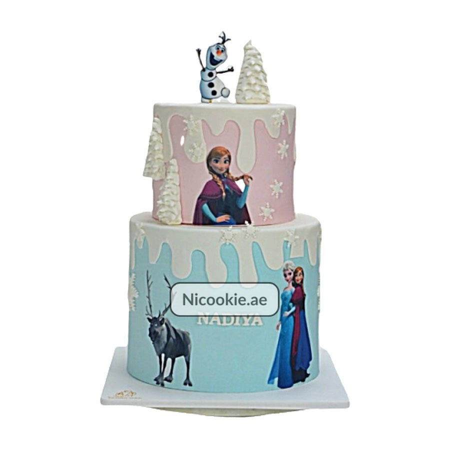 Frozen Winter Wonderland cake with Anna, Elsa, Olaf, and snowy decorations.