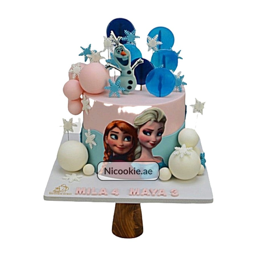 Frozen themed cake with Elsa, Anna, Olaf, and snowflakes.