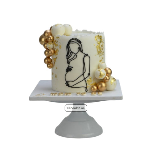 Golden Expectation Cake with a pregnant silhouette and gold accents.
