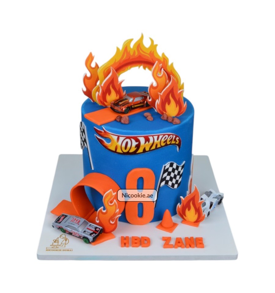 Hot Wheels cake with flames, cars, and the number 8.