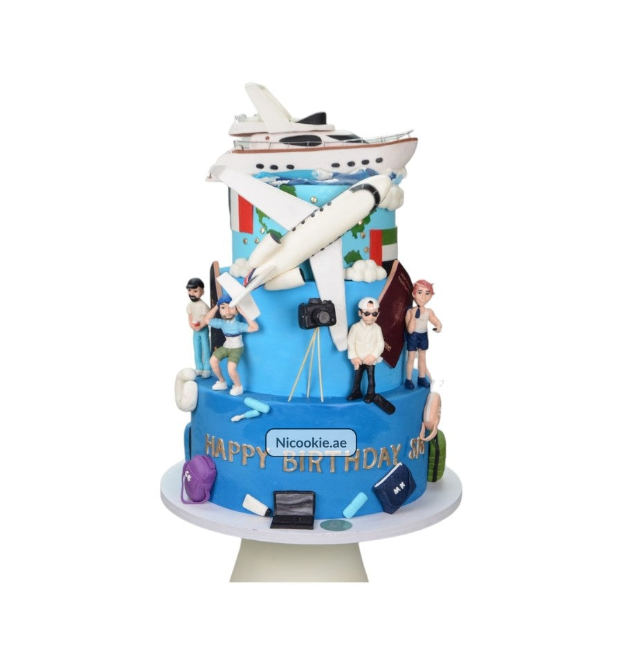 A travel-themed cake with a yacht, airplane, globe, and figurines.