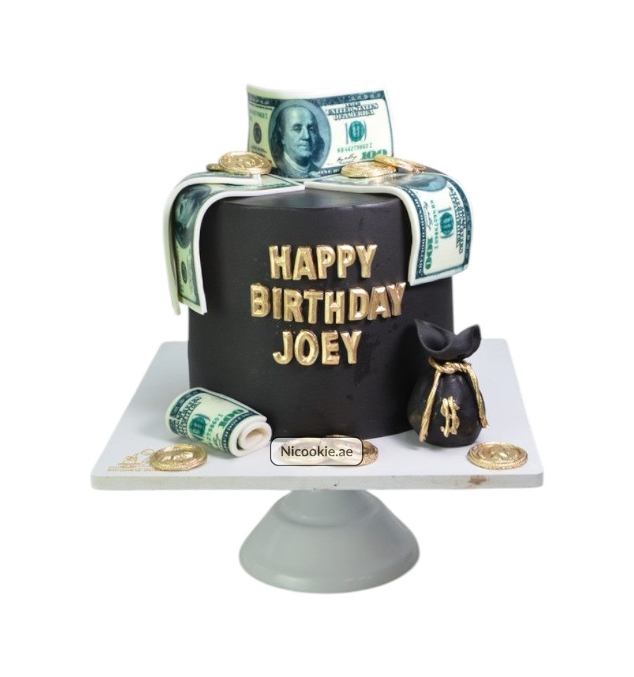 Moneybag birthday cake decorated with edible money and coins.