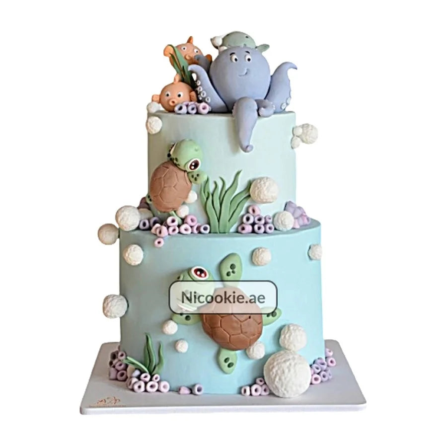 Octopus and sea turtle themed two-tier cake.
