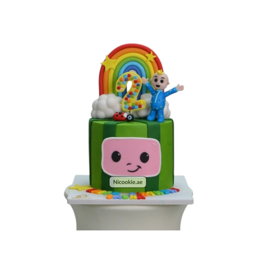 Rainbow Cocomelon cake with a number 2, character, and rainbow.
