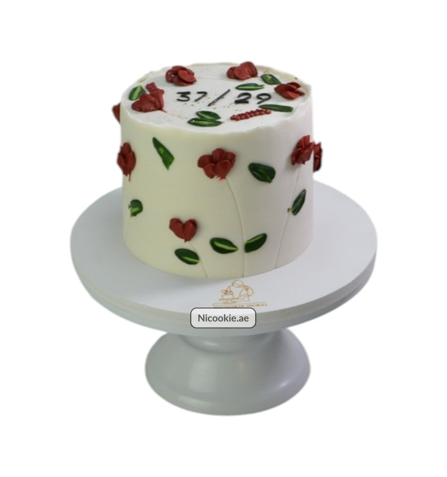 Scarlet Leaf Celebration cake with red flowers and green leaves.