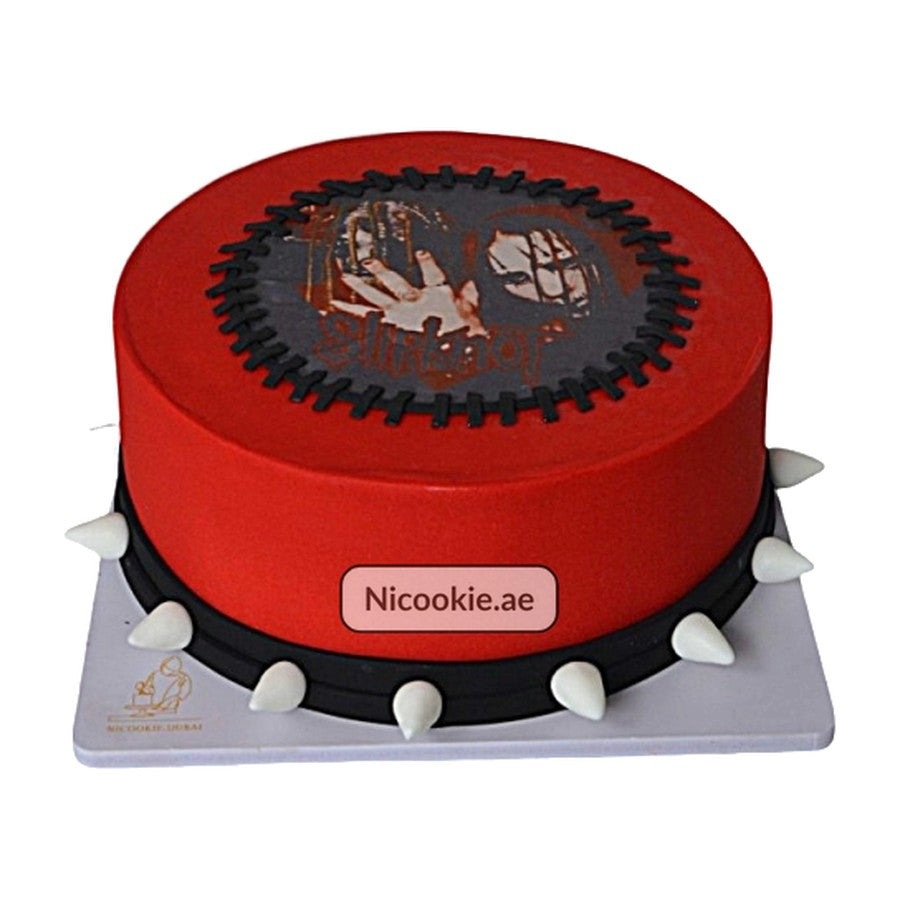 A red Slipknot rock cake with a spiked belt and edible band image.