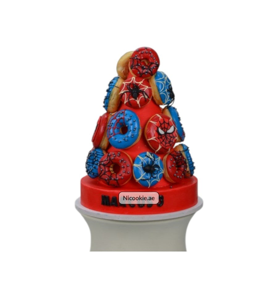 Spider Hero Tower cake decorated with Spider-Man donuts.
