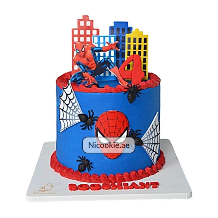 Spiderman cityscape cake with a number 4 topper for a 4th birthday.
