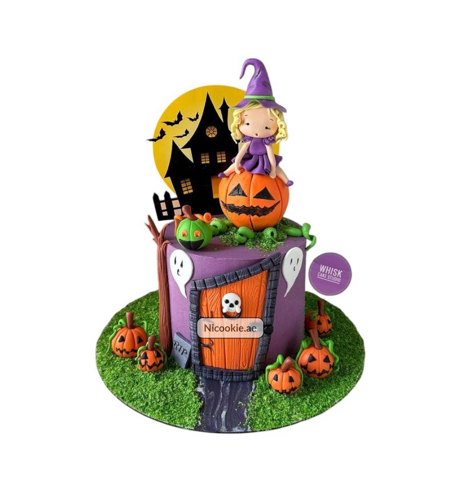 A Halloween cake with a witch on a pumpkin, haunted house, and pumpkins.